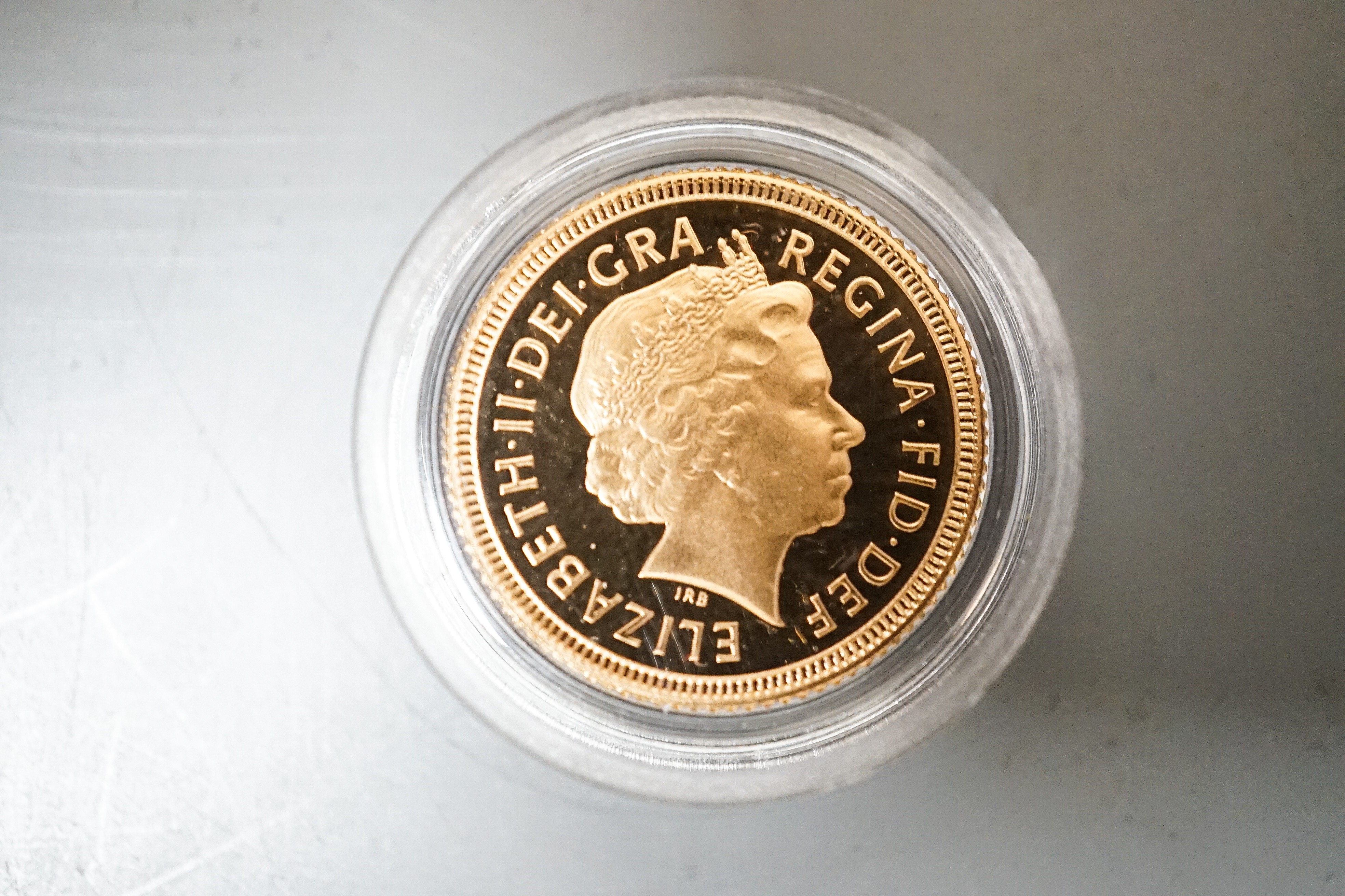 A Queen Elizabeth II gold proof half sovereign 2002 and a London mint Tristan Da Cunha gold piedfort one crown, cased with certificates (2)